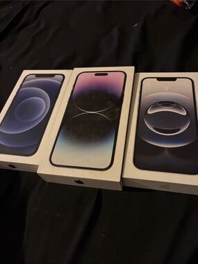 Apple iPhone Trio in Blue, Purple, and Black Display Artwork